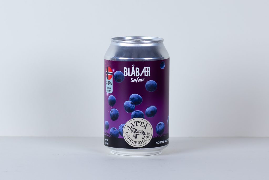 Purple blueberry flavored can labeled Blåbær Safari shown against a light background on a white surface